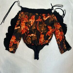 Free People Born To Love ruffle long sleeve Bodysuit NWOT black orange